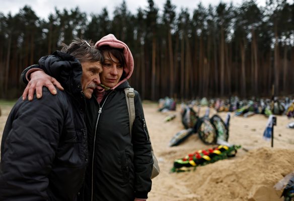 Photo: Anna Proidenko, 57, hugs Igor Bovkunenko during the funeral of their relative Roman Vered, 53, who according to his family was killed by Russian soldiers and recently identified in Kyiv's morgue, amid Russia's invasion of Ukraine, at the cemetery in Irpin, Kyiv region, Ukraine April 18, 2022. Credit: REUTERS/Zohra Bensemra