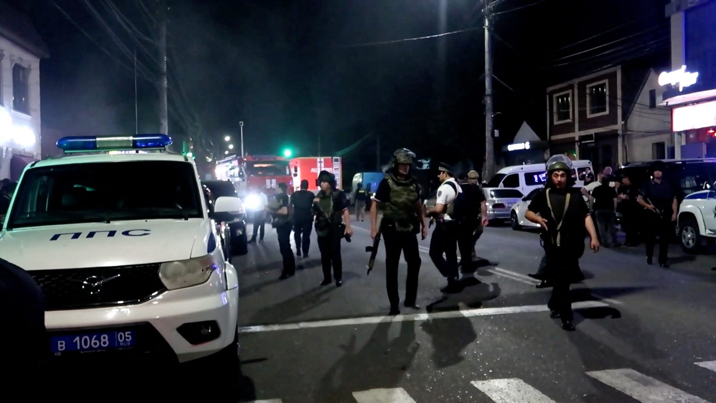 Photo: Law enforcement officers work in the street after an attack by gunmen in Makhachkala in the region of Dagestan, Russia, in this still image from video released June 24, 2024. Credit: National Antiterrorism Committee/Handout via REUTERS