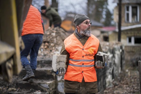 Photo: Irpin, Kyiv Oblast, Ukraine 7 February 2024 Volunteers from the Dobrobat organization work on the demolition and reconstruction of houses destroyed by the Russian military at the beginning of the invasion of Ukraine in Irpin, near the capital Kiev Kyiv Oblast. Credit: IMAGO/Andreas Stroh via Reuters