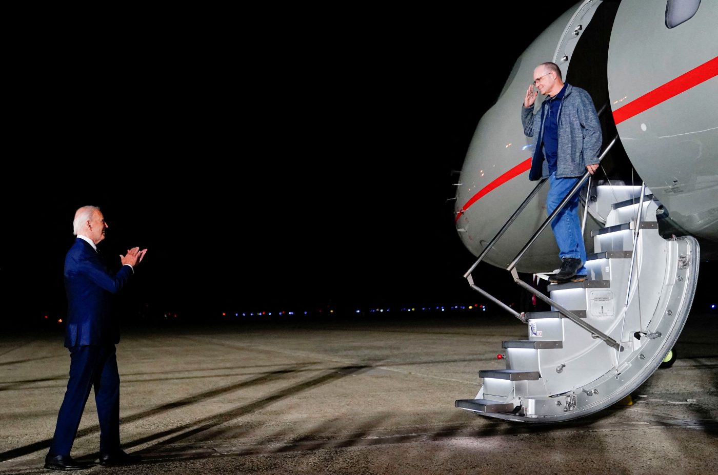 Photo: US President Joe Biden greets Paul Whelan, who was released from detention in Russia, upon his arrival at Joint Base Andrews in Maryland, US, August 1, 2024. Credit: REUTERS/Nathan Howard TPX IMAGES OF THE DAY