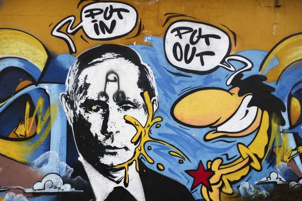 Photo: A mural with the image of Russian President Vladimir Putin and a local cartoon character known as Szwedzik pissing on Putin's face, with the inscription 'Put In' and 'Put Out' is seen in Katowice, Poland on March 10, 2023. Mural was created by street artists known as Szwedzki and R3al. Credit: Beata Zawrzel/NurPhoto