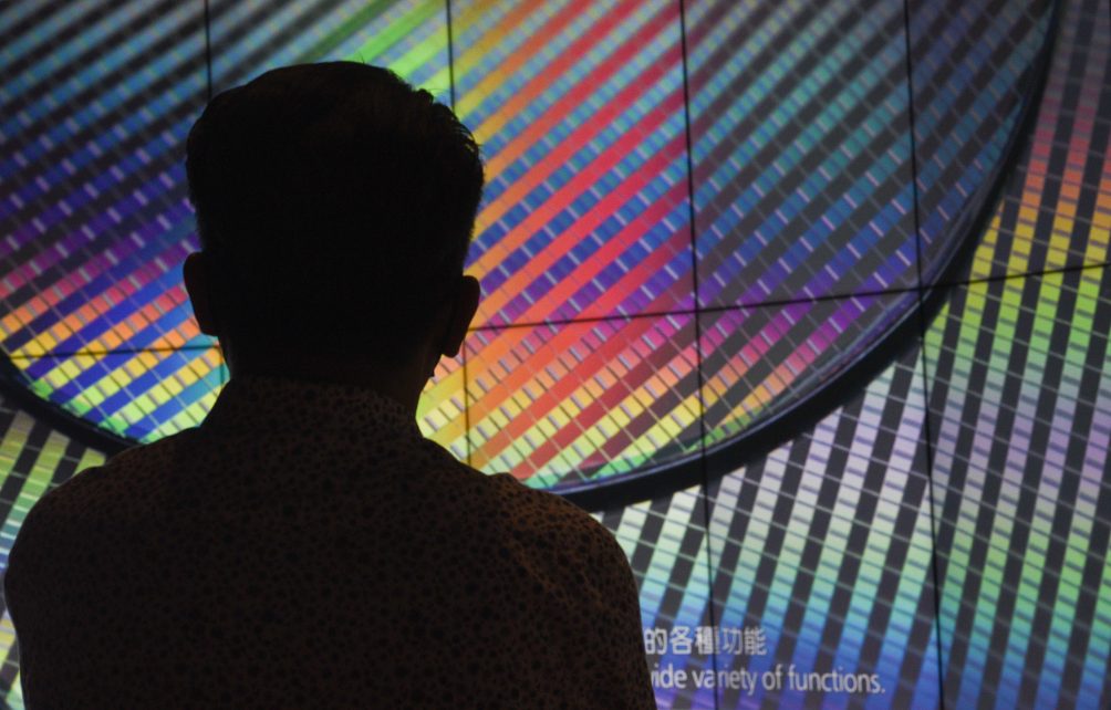Photo: A visitor of the TSMC Museum of Innovation watches a promotional video explaining how the Taiwan Semiconductor Manufacturing Company (TSMC) manufactures its integrated circuits and wafer semiconductor devices. October 06, 2023 - Hsinchu, Taiwan. Credit: Mehdi Chebil / Hans Lucas via Reuters Connect.