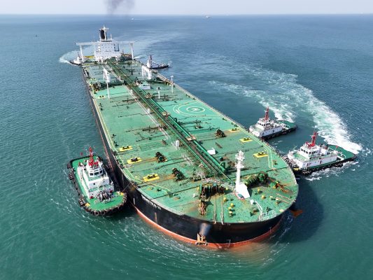 Photo: A very large oil tanker is being assisted by a tugboat as it berths at Yantai Port's 300,000-ton crude oil terminal in Yantai, Shandong Province, China, on April 25, 2024. Credit: Costfoto/NurPhoto
