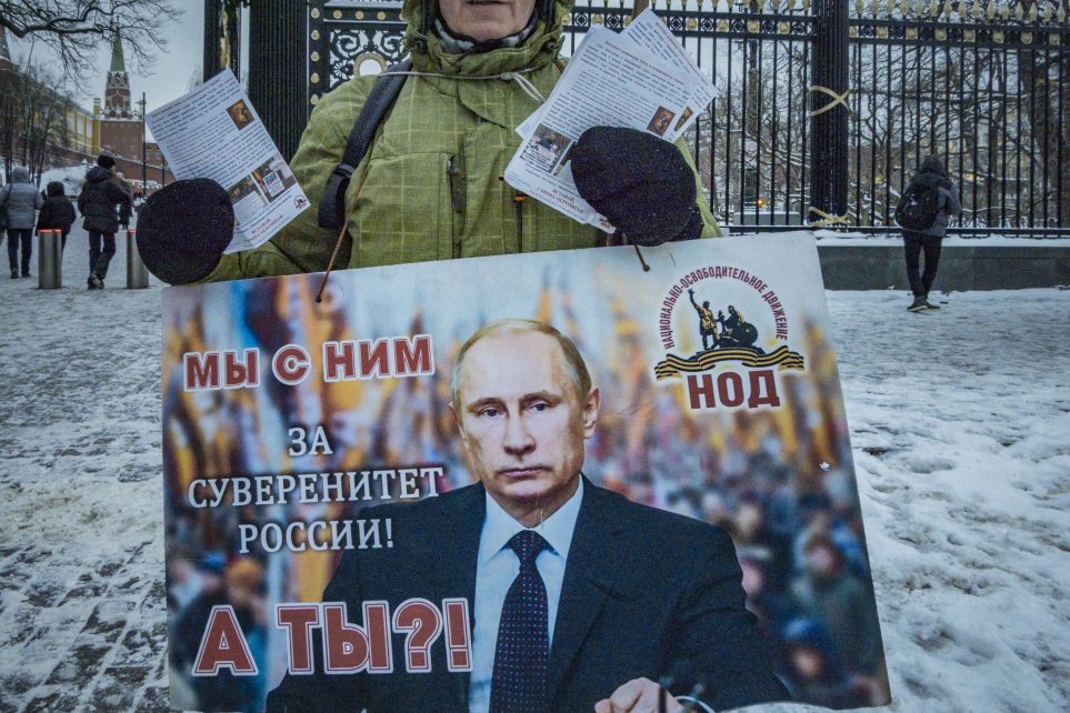 Photo: Portrait of Putin in a disinformation banner of a supporter of the Russian invasion of Ukraine in the streets of Moscow, on March 10, 2023. Banner says: ''We are with him, for the Russian sovereignty, and you?'' Credit: Celestino Arce/NurPhoto