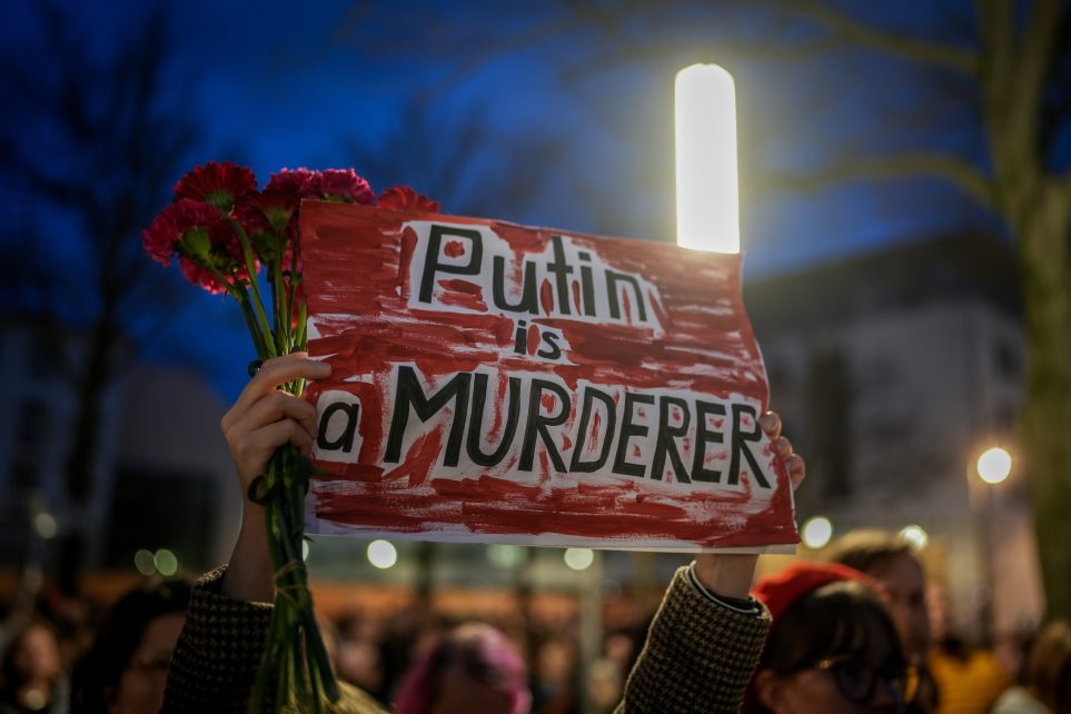 Photo: Protesters gather in front of the Russian embassy with a sign reading "Putin is a murderer" following the death of Alexei Navalny. The Russian opposition leader died in a Russian prison, according to the Russian penitentiary service. Credit: Kay Nietfeld/dpa via Reuters Connect