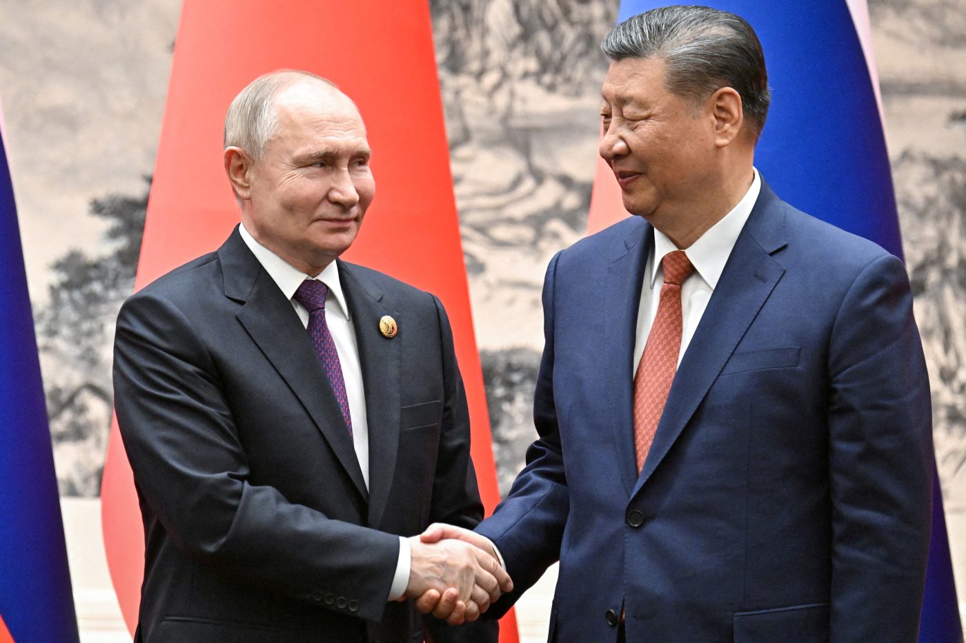 Photo: Russian President Vladimir Putin shakes hands with Chinese President Xi Jinping during a meeting in Beijing, China May 16, 2024. Credit: Sputnik/Sergei Bobylev/Pool via REUTERS