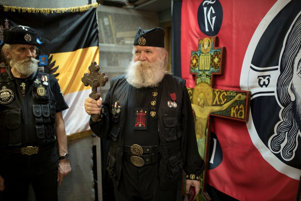 Photo: Leonid Simonovich-Nikshich (R), head of the Union of Orthodox Banner-Bearers and Igor Miroshnichenko, his deputy, prepare for award ceremony at their headquarter in Moscow, Russia, July 12, 2018. Military Orthodox Mission, a group that espouses socially conservative Orthodox values, awarded some union members for their work to commemorate Tsar Nicholas II. "We are striving for the restoration of an autocratic monarchy. Like the one we had under our tsars," Simonovich-Nikshich said. "It is only possible through the church. In no way is this possible in a political secular way because that would be a dictator." Credit: REUTERS/ Ekaterina Anchevskaya