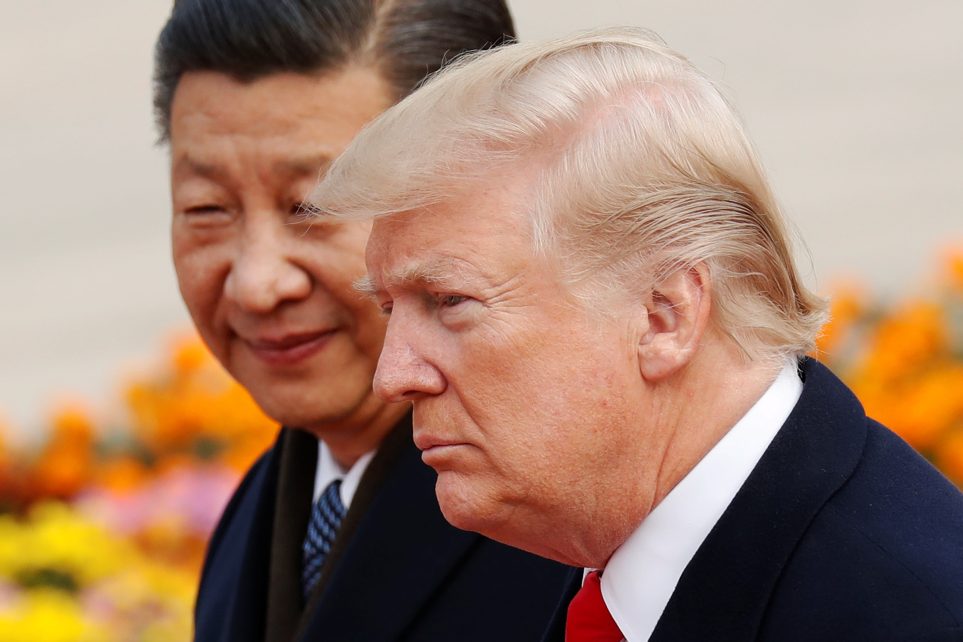 Photo: US President Donald Trump takes part in a welcoming ceremony with China's President Xi Jinping in Beijing, China, November 9, 2017. Credit: REUTERS/Damir Sagolj