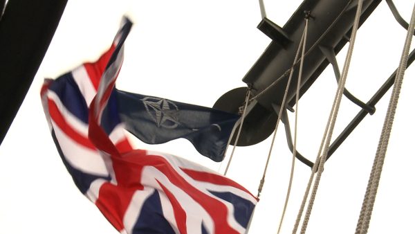 Photo: British flag is pulled down during the Exercise Joint Warrior in Scotland, a major UK-led maritime exercise with strong NATO and Allied participation taking place from 11 to 24 April. Credit: NATO Flickr via https://flic.kr/p/rRzmmP