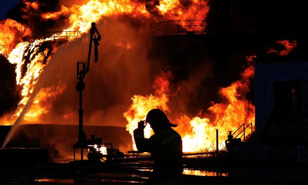 Photo: A firefighter works to extinguish fire following recent shelling at an oil storage in the course of Russia-Ukraine conflict in the town of Shakhtarsk (Shakhtyorsk) near Donetsk, Russian-controlled Ukraine, October 27, 2022. Credit: REUTERS/Alexander Ermochenko