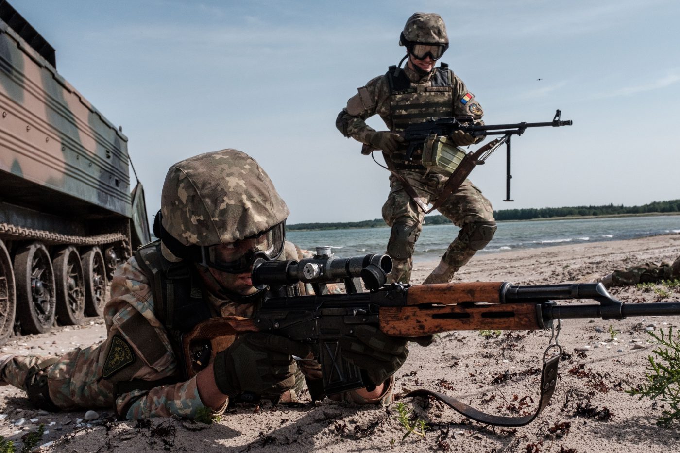 Photo: Romanian Marines storm a beach on Saaremaa Island in Estonia during BALTOPS 2019. An annual US-led exercise involving 16 NATO Allies and two partner nations, BALTOPS focuses on improving maritime interoperability through multinational amphibious operations in the Baltic Sea region. Credit: NATO Flickr https://flic.kr/p/2gfAkWW