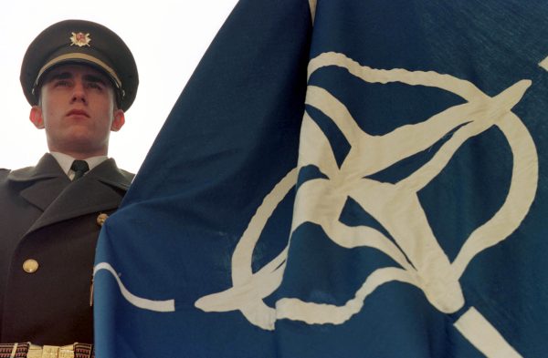 Photo: A Czech honour guard prepares to hoist the NATO flag during ceremonies outside the Czech Ministry of Defence in Prague March 18. The Czech Republic, along with Poland and Hungary, joined the NATO military alliance March 12. Credit: SG/KM