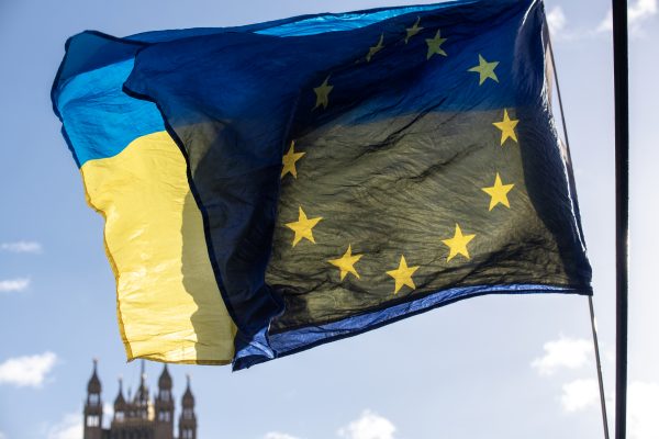 Photo: EU flag and the Ukrainian flag fly together by the Tower of the British Parliament in London. Pro-EU activists organised a small protest today at the Parliament in London, UK. Protesters demand general election and to rejoin the European Union. Credit: Krisztian Elek / SOPA Images/Sipa USA