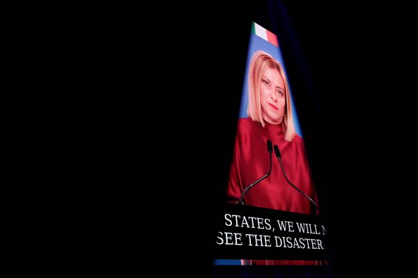 Photo: Italy's Prime Minister Giorgia Meloni appears on a screen as she remotely addresses the Conservative Political Action Conference (CPAC) annual meeting in National Harbor, Maryland, U.S., February 22, 2025. Credit: REUTERS