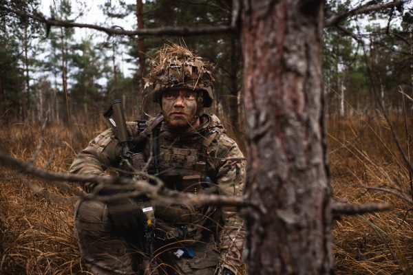 Photo: A Royal Danish Army soldier holds his position during exercise Resolute Warrior 24 at Adaži, Latvia on 6 November 2024. Resolute Warrior 24 marked the first time that Multinational Brigade Latvia exercised as a brigade-level formation since its founding in July. NATO Allies decided to increase several multinational battlegroups to brigade-sized units following the Madrid Summit in 2022. Credit: NATO Flickr via https://flic.kr/p/2quhmzY