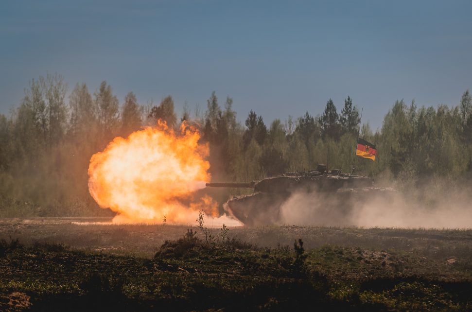 Photo: A German Army Leopard 2A7V tank fires a round while taking part in the Canadian Army Trophy tank competition at Ādaži in Latvia. The Canadian Army Trophy tank competition, held in May 2024, allowed participating nations to show off their gunnery skills while building camaraderie. Credit: NATO Flickr via https://flic.kr/p/2pVWDuU