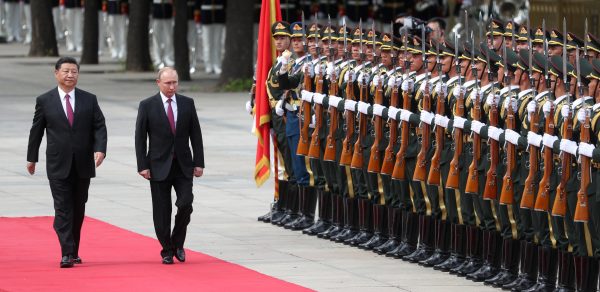 Photo: MYTBAC 08 June 2018, China, Beijing: Vladimir Putin (R), President of Russian, being received with military honors by Xi Jinping, President of China. Putin is in China for talks with the Chinese President. He is also expected for a meeting of the Shanghai Cooperation Organisation during the weekend. The regional summit takes place in the eastern Chinese city of Qingdao. RUSSIA OUT Credit: Pavel Bednyakov/dpa