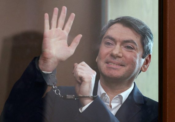 Photo: Grigory Melkonyants, the co-chair of Russia's election monitoring group Golos (Voice), who is accused of cooperating with an "undesirable organisation", reacts inside an enclosure for defendants during a court hearing in Moscow, Russia May 14, 2025. Credit: REUTERS/Evgenia Novozhenina