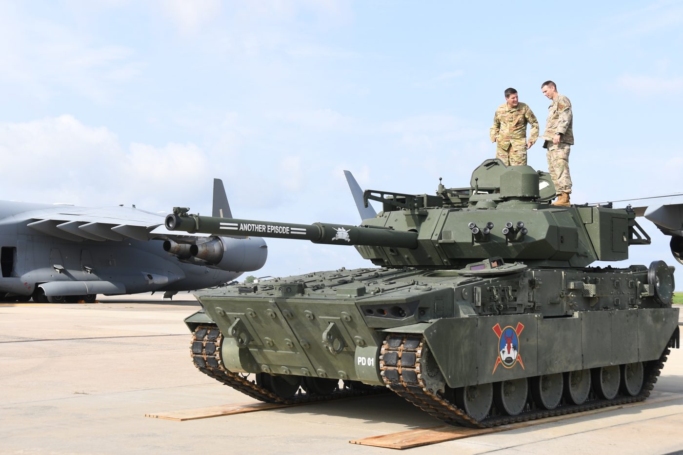 Photo: Members of the North Carolina Air National Guard assess an Army M10 Booker Combat Vehicle before it is loaded onto a C-17 Globemaster III aircraft, at the North Carolina Air National Guard base, Charlotte-International Airport, August 3, 2024. Portions of this photo were masked for security reasons. Credit: Tech. Sgt. Laura Tickle/US Air National Guard