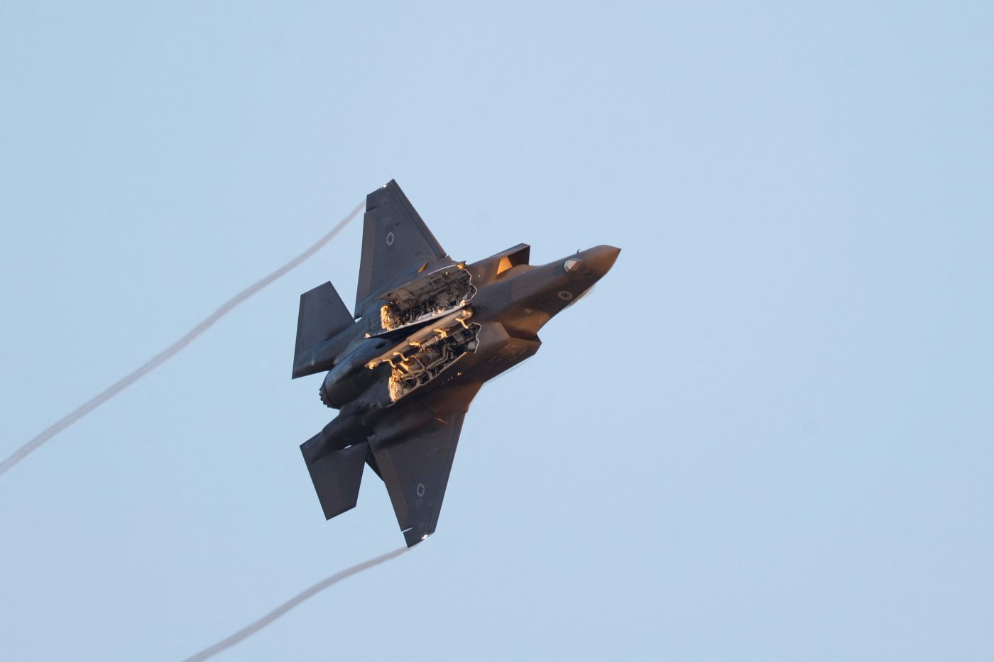 Photo: A F-35 fighter jet flies with weapon bay doors open during a graduation ceremony for Israeli Air Force pilots at Hatzerim Airbase, in southern Israel, June 29, 2023. Credit: REUTERS/Amir Cohen