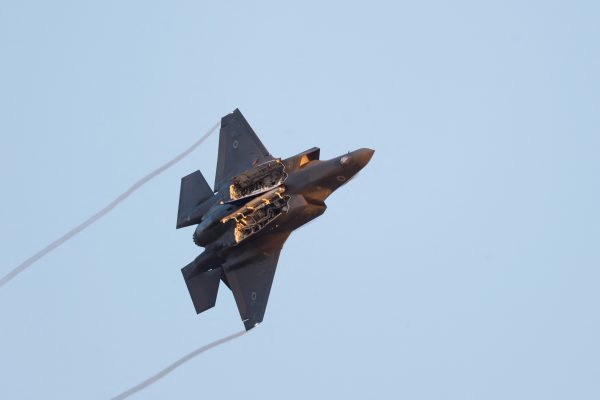 Photo: A F-35 fighter jet flies with weapon bay doors open during a graduation ceremony for Israeli Air Force pilots at Hatzerim Airbase, in southern Israel, June 29, 2023. Credit: REUTERS/Amir Cohen