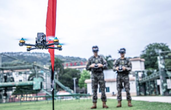 Photo: Participants in an unmanned aerial vehicle (UAV) training team are performing an obstacle clearing training in Nanning, China, on May 9, 2024. Credit: Costfoto/NurPhoto