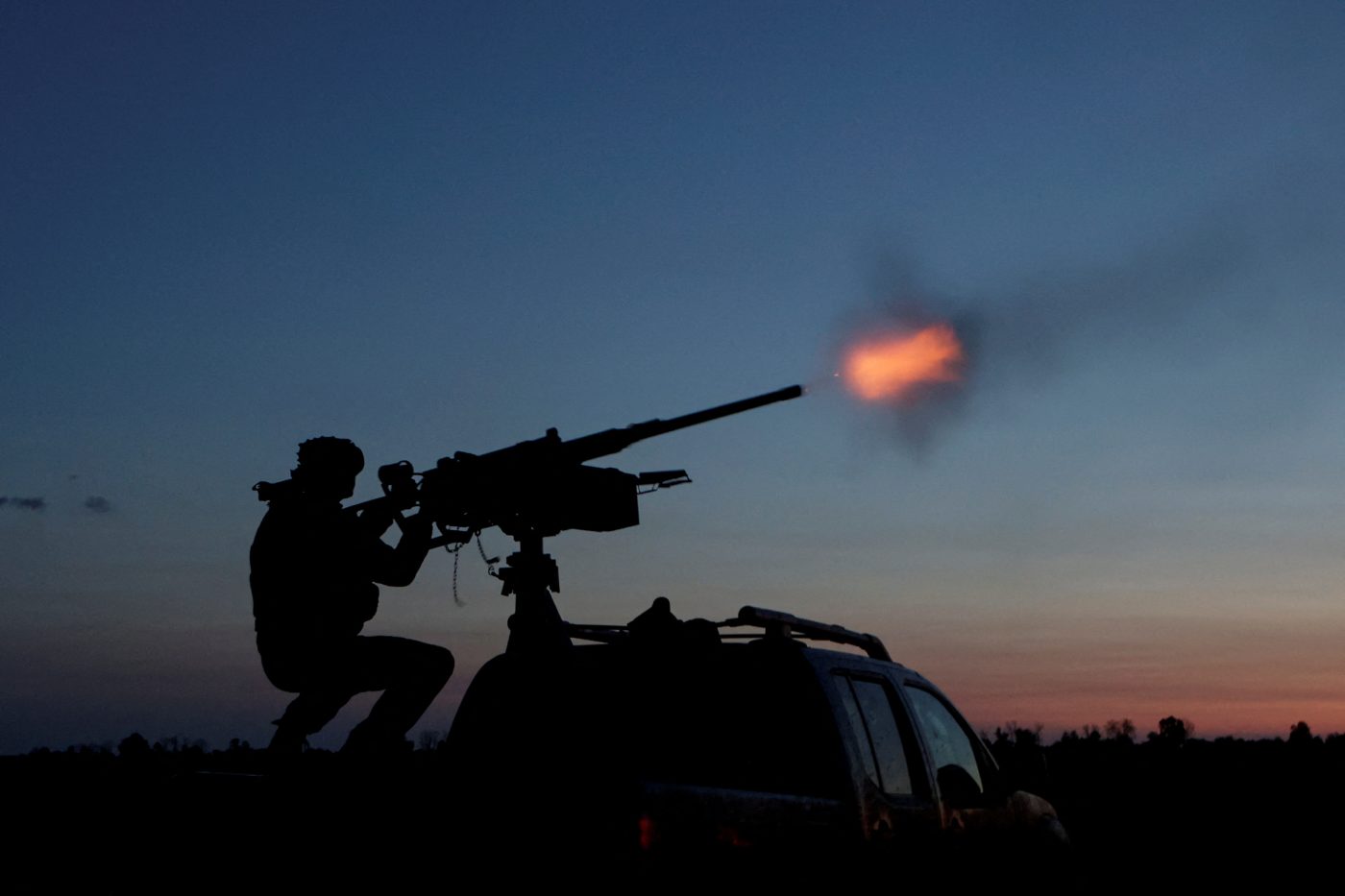Photo: A serviceman from the mobile air defence unit of the 115th Separate Mechanized Brigade of the Ukrainian Armed Forces fires a Browning machine gun towards a Russian drone during an overnight shift, amid Russia's attack on Ukraine, in Kharkiv Region, Ukraine June 2, 2025. Credit: REUTERS/Sofiia Gatilova