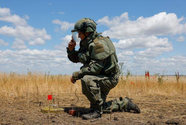 Photo: A sapper of the Russian armed forces places an explosive charge before destroying a mine during an operation to search for explosives and demine an area near the town of Marinka (Maryinka) in the course of Russia-Ukraine military conflict in the Donetsk region, a Russian-controlled territory of Ukraine, June 24, 2025. Credit: REUTERS/Alexander Ermochenko