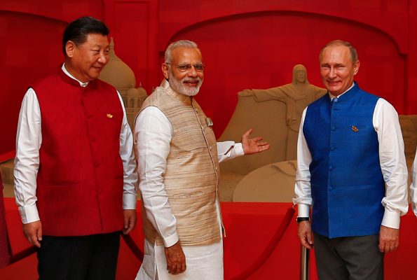 Photo: (L-R) Chinese President Xi Jinping, Indian Prime Minister Narendra Modi and Russian President Vladimir Putin pose infront of a sand sculpture ahead of BRICS (Brazil, Russia, India, China and South Africa) Summit in Benaulim, in the western state of Goa, India, October 15, 2016. Credit: REUTERS/Danish Siddiqui