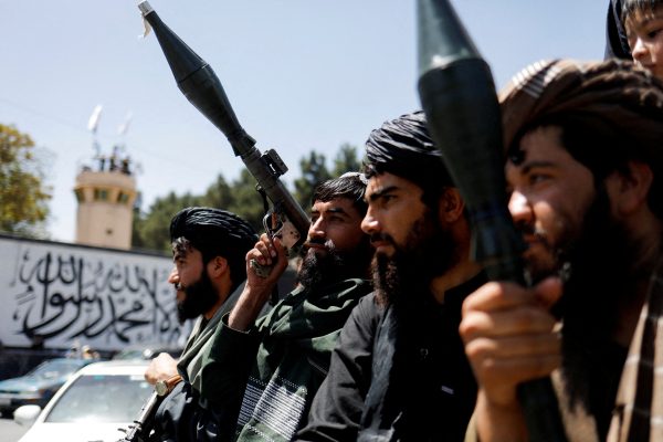 Photo: Taliban soldiers celebrate on the second anniversary of the fall of Kabul on a street near the US embassy in Kabul, Afghanistan, August 15, 2023. Credit: REUTERS/Ali Khara/File Photo