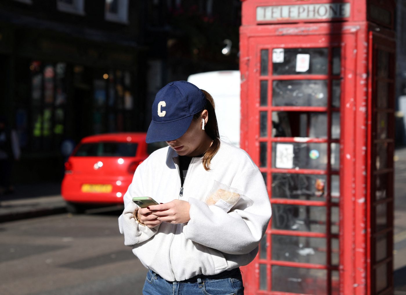 Photo: A person uses their smartphone in London, Britain, October 11, 2024. Credit: REUTERS/Mina Kim