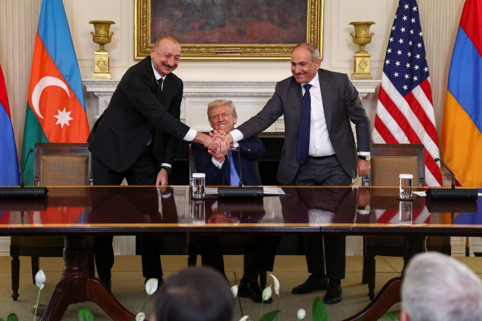 Photo: U.S. President Donald Trump holds the hands of Azerbaijan's President Ilham Aliyev and Armenia's Prime Minister Nikol Pashinyan as they shake hands between each other during a trilateral signing event, at the White House, in Washington, D.C., August 8, 2025. Credit: REUTERS/Kevin Lamarque