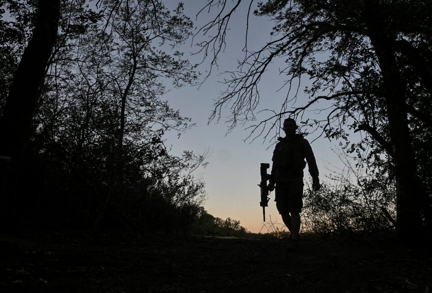 Photo: A serviceman of the 141st Separate Mechanized Brigade of the Ukrainian Armed Forces walks at a position near a front line, amid Russia's attack on Ukraine, in Donetsk region, Ukraine September 3, 2025. Credit: REUTERS/Stringer TPX IMAGES OF THE DAY