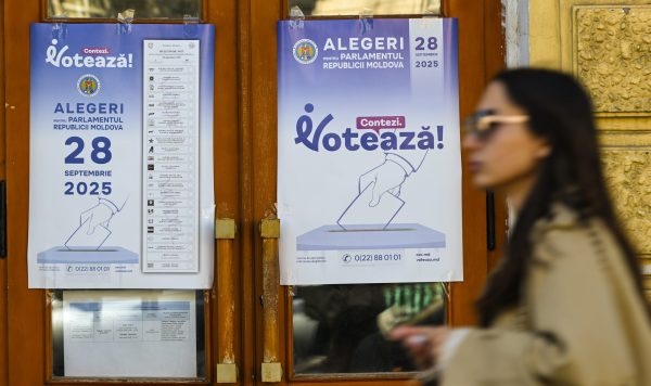 Photo: A woman walks by a Election poster in Chisinau city center, two days ahead of the 2025 parliamentary election, in Chisinau, Moldova, on September 26, 2025. Moldovans vote on September 28 to elect 101 members of parliament for a four-year term. CHISINAU, MOLDOVA – SEPTEMBER 26, 2025 Credit: STR/NurPhoto