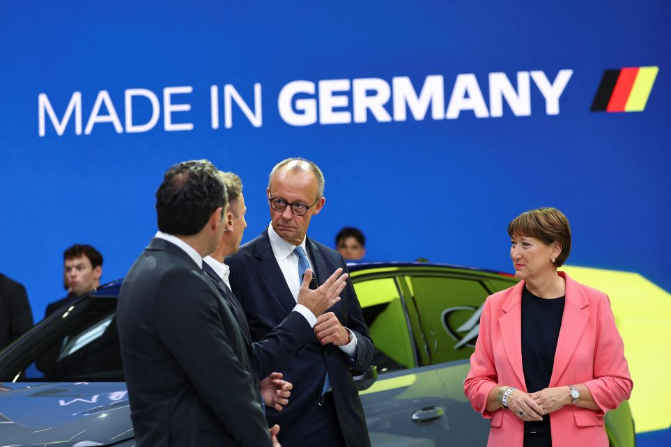 Photo: German Chancellor Friedrich Merz and German Association of the Automotive Industry (VDA) President Hildegard Mueller tour the Opel fair booth at the IAA Mobility 2025 auto show in Munich, Germany, September 9, 2025. Credit: REUTERS/Kai Pfaffenbach