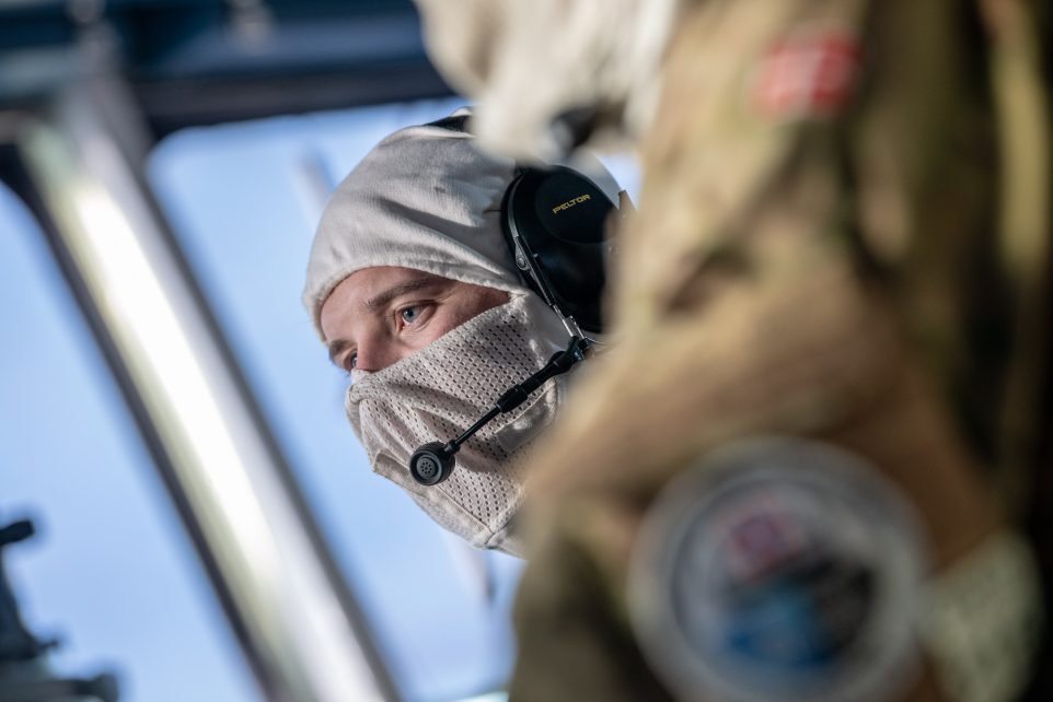 Photo: NORWEGIAN SEA, Nov 6. 2018. A Royal Danish Navy radio operator keeps watch during the Battle Station aboard SNMG1 Flagship HDMS Esbern Snare, while participating in the War At Sea Exercise (WASEX) last stage at sea of Trident Juncture 18. Trident Juncture 18 is designed to ensure that NATO forces are trained, able to operate together and ready to respond to any threat from any direction. Trident Juncture 18 takes place in Norway and the surrounding areas of the North Atlantic and the Baltic Sea, including Iceland and the airspace of Finland and Sweden. With around 50,000 participants from 31 nations Trident Juncture 2018 is one of NATO’s largest exercises in recent years. More than 250 aircraft, 65 ships and 10,000 vehicles are involved in the exercise to perform and conduct air, land, maritime, special operation and amphibious drills. NATO Photo By WO FRAN C.Valverde. 2018. GEN. SNMG1 PROVIDES MARITIME PROTECTION AND DEFENSE TO SF. Trident Juncture 18 is designed to ensure that NATO forces are trained, able to operate together and ready to respond to any threat from any direction. Trident Juncture 18 takes place in Norway and the surrounding areas of the North Atlantic and the Baltic Sea, including Iceland and the airspace of Finland and Sweden. With around 50,000 participants from 31 nations Trident Juncture 2018 is one of NATO’s largest exercises in recent years. More than 250 aircraft, 65 ships and 10,000 vehicles are involved in the exercise to perform and conduct air, land, maritime, special operation and amphibious drills. Credit: NATO Photo By WO FRAN C.Valverde via Flickr https://flic.kr/p/2bDrv6y