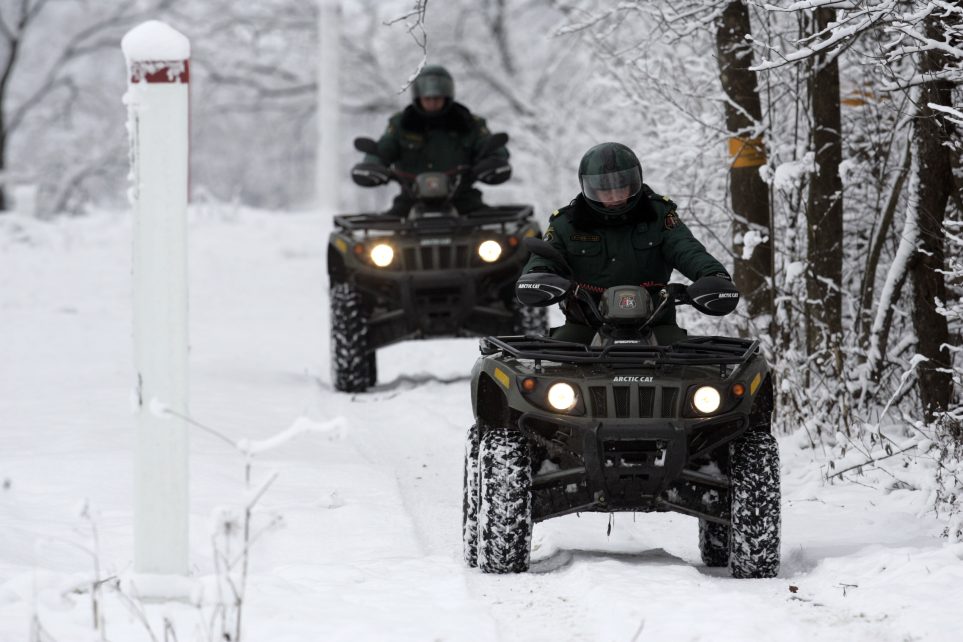 Photo: Latvian border guards Nikolajs Vorslovans (R) and Viktors Zolnerovics drive quads during their patrol near the Latvian-Belarussian border in Piedruja 300 km (187 miles) from the capital Riga November 13,2007. Travellers will be able to drive from Riga to Rome or from Prague to Porto without once showing their passports after EU ministers agreed on Thursday to extend the bloc's border-free zone to nine more EU states from December 21. The Czech Republic, Estonia, Hungary, Lithuania, Latvia, Malta, Poland, Slovakia and Slovenia will join the so-called Schengen zone which encompasses 15 states. Credit: REUTERS/Ints Kalnins