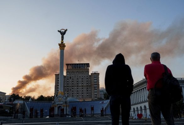 Photo: People look at smoke rise over a building of the Ukrainian government headquaters after Russian drone and missile strikes, amid Russia’s attack on Ukraine, in Kyiv, Ukraine September 7, 2025. Credit: REUTERS/Serhii Korovainyi