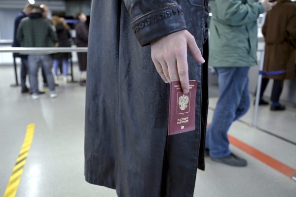 Photo: Ivan, 23, of Russia waits in a queue to have his passport checked at the Vaalimaa border check point in Virolahti, Finland, on September 25, 2022. Ivan who arrived in Finland without a visa wants to apply for asylum. Credit: Jussi Nukari/Lehtikuva/via REUTERS