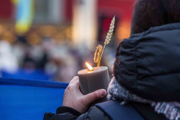 Photo: November 26, 2022, Munich, Bavaria, Germany: As the world sees Russia attacking civilians and civilian infrastructure resulting in loss of power and water to large amounts of Ukraine, Ukrainians are reminded of the Holodomor Famine/ Holodomor Genocide of the winter of 1932-1933 where wheat production was hampered due to various factors and millions died. Ukraine and numerous other countries recognize the event as a genocide. Orthodox clergy were in attendance to also memorialize the dead. Credit: Image © Sachelle Babbar/ZUMA Press Wire