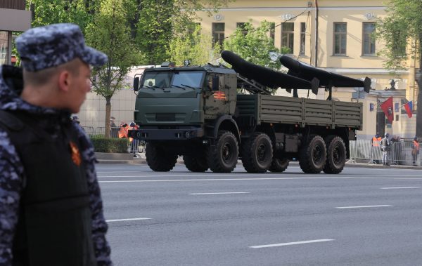 Photo: A member of Russia's National Guard keeps order as an armoured truck transporting Geran unmanned comabt aerial vehicles drives along a road on the day of a rehearsal for a military parade, which marks the 80th anniversary of the victory over Nazi Germany in World War Two, in Moscow, Russia, May 7, 2025. Credit: REUTERS/Shamil Zhumatov