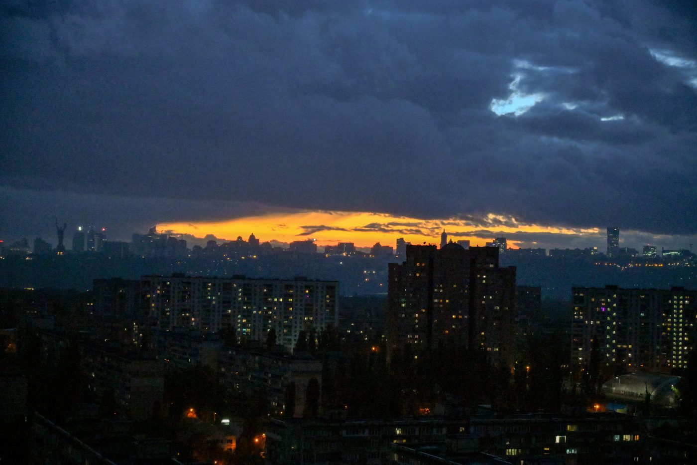 Photo: Partially blacked-out residential blocks stand under the orange evening sky as the city faces scheduled power outages caused by Russian strikes on Ukraine's energy infrastructure and higher electricity demand in cold weather in Kyiv, Ukraine, on October 29, 2025. Credit: Photo by Yevhen Kotenko/Ukrinform