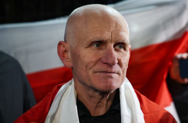 Photo: Ales Bialiatski, a prisoner released from Belarus, appears outside the U.S. embassy, following his release from Belarus, in Vilnius, Lithuania, December 13, 2025. Credit: REUTERS/Gonzalo Fuentes