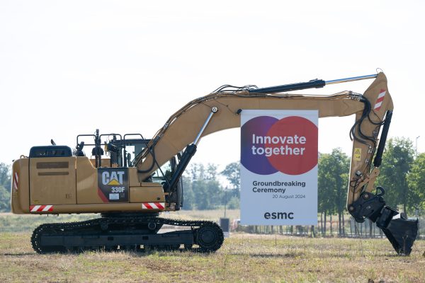 Photo: A hydraulic crawler excavator stands with a banner reading "Innovate together" on the occasion of a symbolic ground-breaking ceremony on the future site of the chip factory under the name European Semiconductor Manufacturing Company (ESMC). Production at the new chip factory of Taiwanese chip manufacturer TSMC is scheduled to begin in 2027. Credit: Reuters